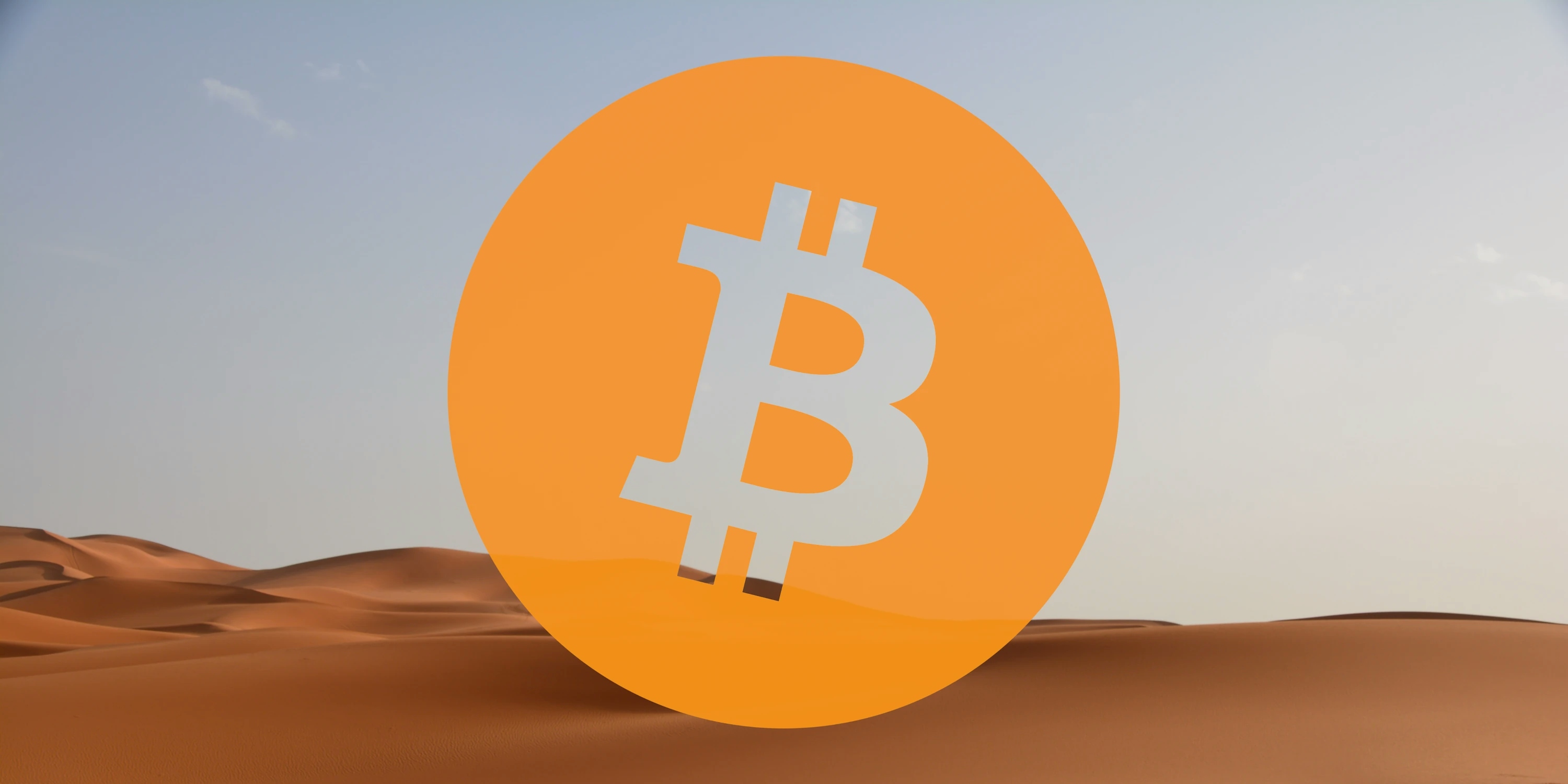 Bitcoin logo overlaid on a desert picture